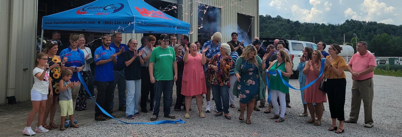 Central Heating & Air Conditioning team celebrating 50 years in the HVAC industry at their office in Kingston, Tennessee.